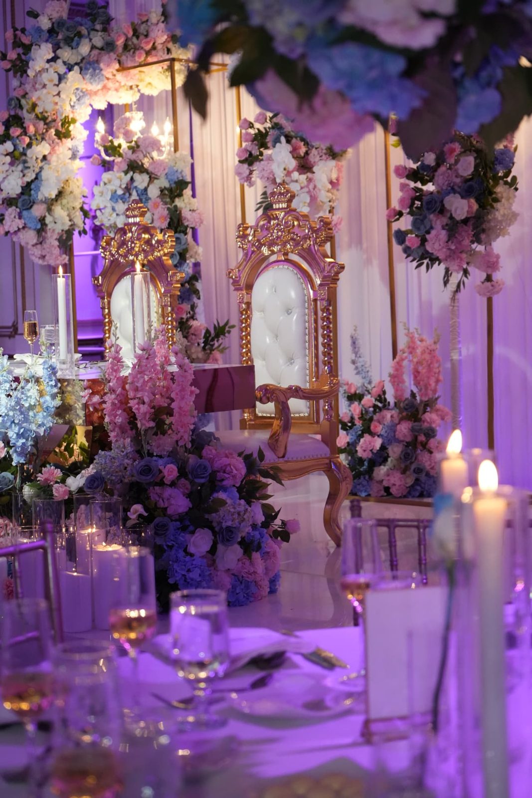 Let's Bloom Florist engagement party sweetheart table with pink and blue florals and gold thrones