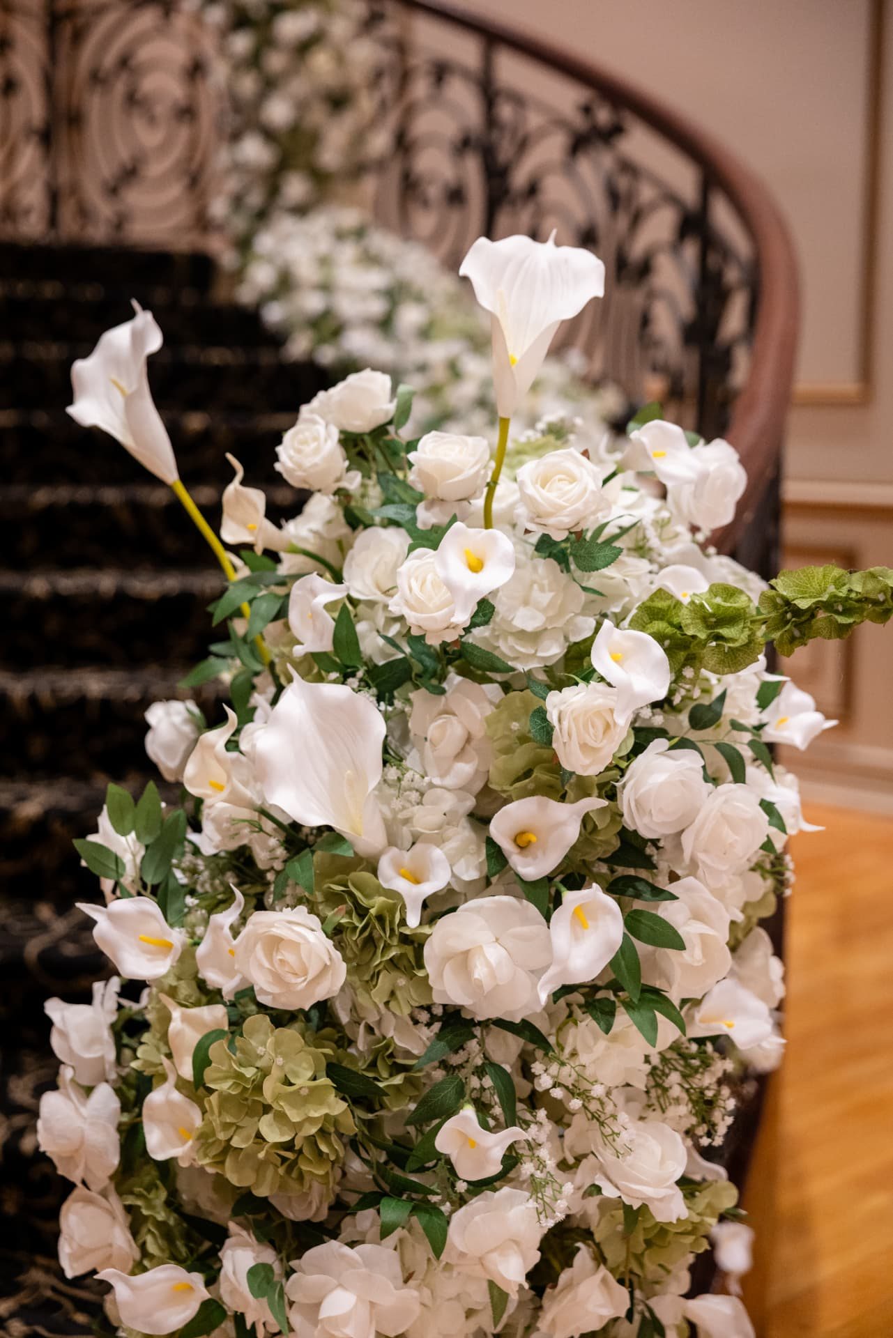 Newel Post Cascade · White Roses, Calla Lilies and Green Hydrangea at the Foot of the Staircase — The Tides Estate · North Haledon, NJ, by Let's Bloom Florist