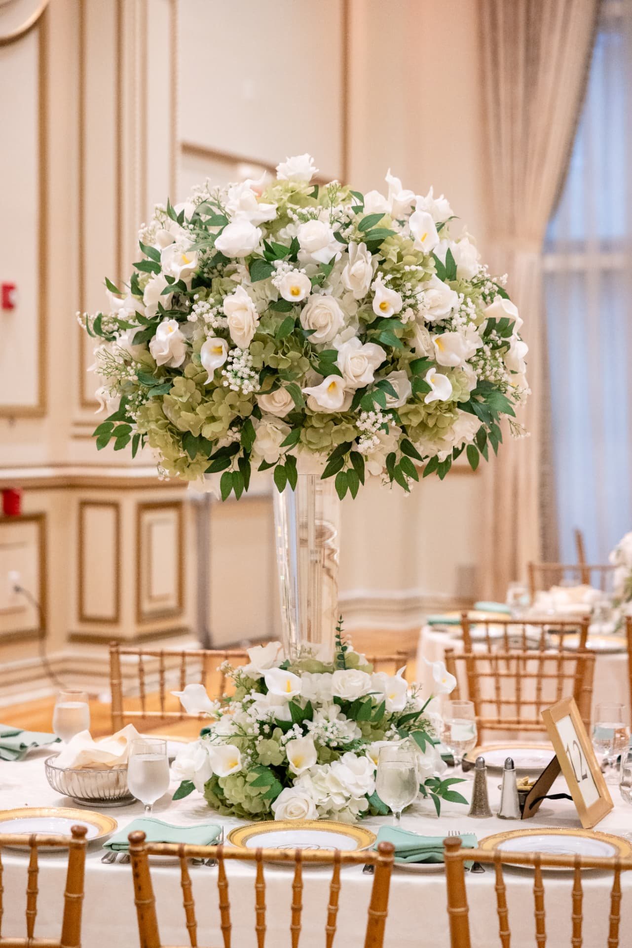 Tall Centerpiece · Sphere of White Roses, Calla Lilies and Green Hydrangea on a Clear Glass Vase — The Tides Estate · North Haledon, NJ, by Let's Bloom Florist