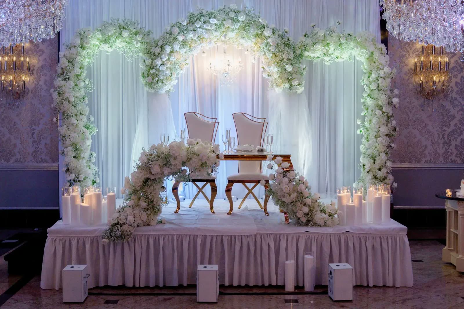 Double floral arch over the sweetheart table at The Venetian, Garfield NJ, by Let's Bloom Florist